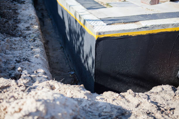 Professional Basement Waterproofing technician working in Dorothy, NJ